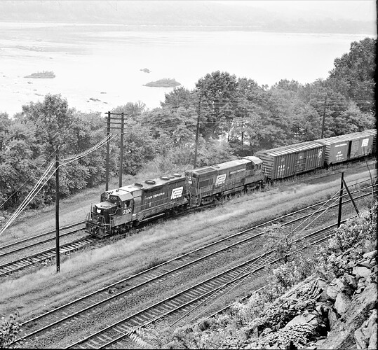 Penn Central GP-35 #2300; GE-U25-B #2749 at Banks Tower, near Marysville, PA. September 29, 1973