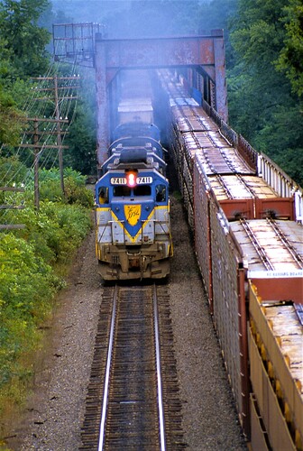 D&H GP38-2 #7411, GP39-2 #7321, C-420 #412 & C424m #451 with freight taken from Rt 7 at Sydney, NY. August 1984.