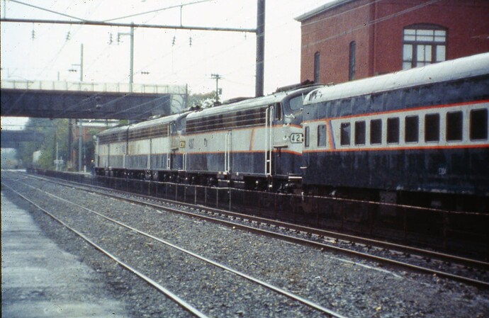 NJT. E-8 #4253, #4247 & #4257 with end of E-8 fan trip, crossing John St, South Amboy, NJ. Sept 1987