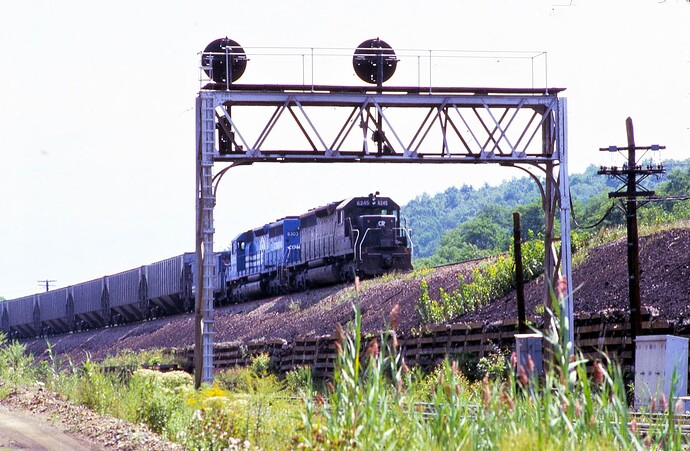 Conrail. SD-40's #6245 & # 6303 has exited the tunnels at Gallitzin, PA. July 17, 1977