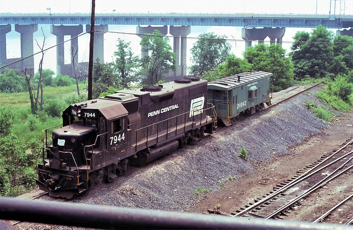 Enola cab track (pimple track) GP38-2 #7944 with an N-10 caboose #24042; June 1974