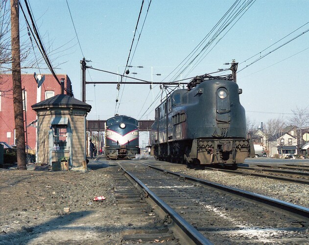NJT. GG-1 #4878 drops train off to E-8 #4305 at South Amboy, NJ  for run to Bay Head, NJ. 1983