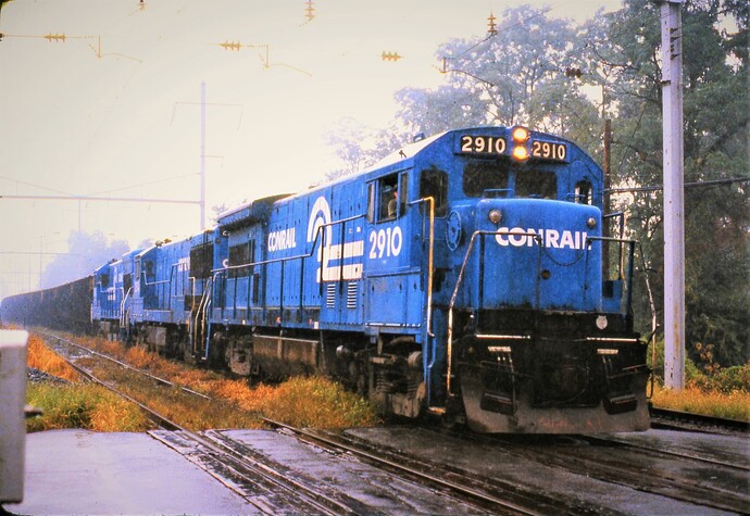 CR. GE U33B #2910 (ex-PC, blt 11-68) leads a eastbound freight on a rainy Friday at W. Fairview, PA in Sept 15, 1979